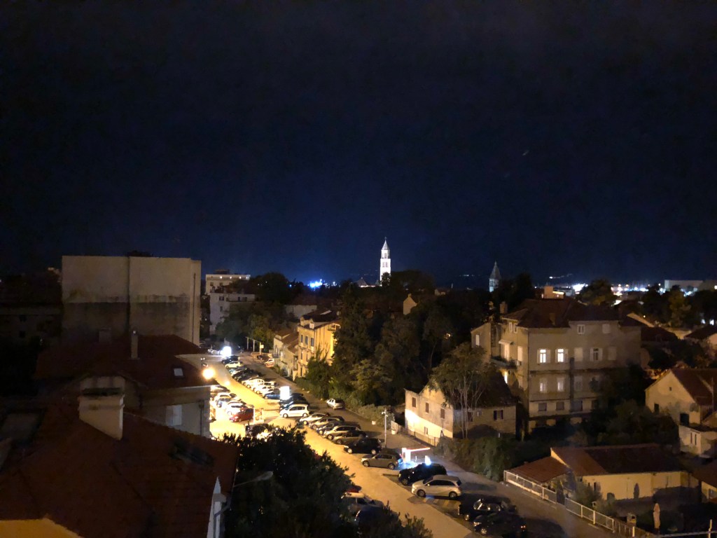The view of our our walk up through the hostel through the row of parked cars. 